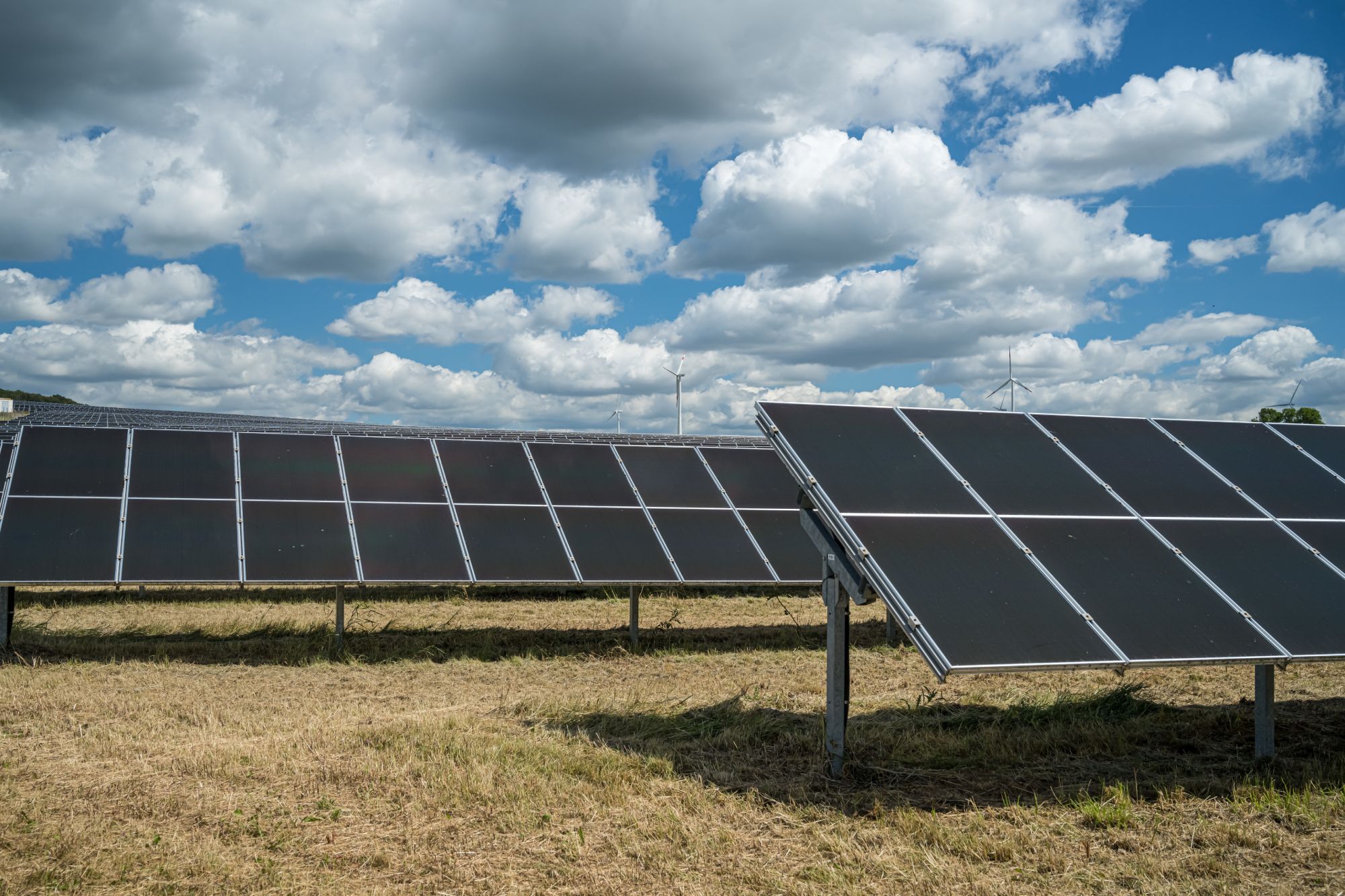 solar-panels-grain-field-countryside-cloudy-sky (1)
